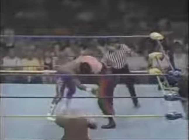 Ron Simmons holds his ground as Vader attempts to lift him for a suplex.